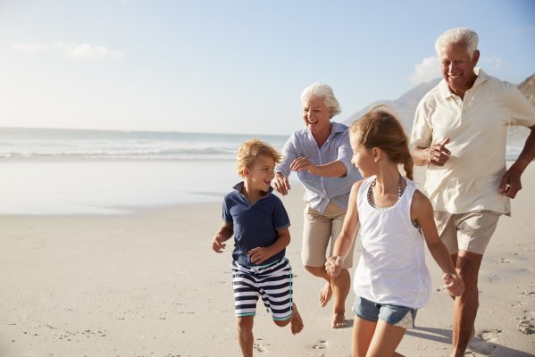 happy seniors running with nephews on the beach medical alert systems lifestation benefits